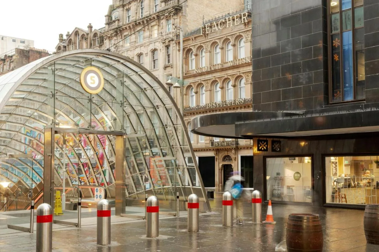 a city street with a large building with a glass at VCity Suites at The Teacher in Glasgow